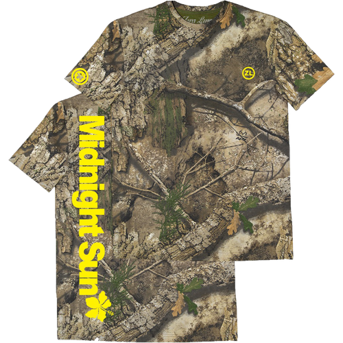 A short-sleeve t-shirt with an all-over woodland camouflage pattern, featuring a large vertical yellow 'Midnight Sun' text graphic on the right sleeve and a small yellow circular logo on the left chest and right shoulder.